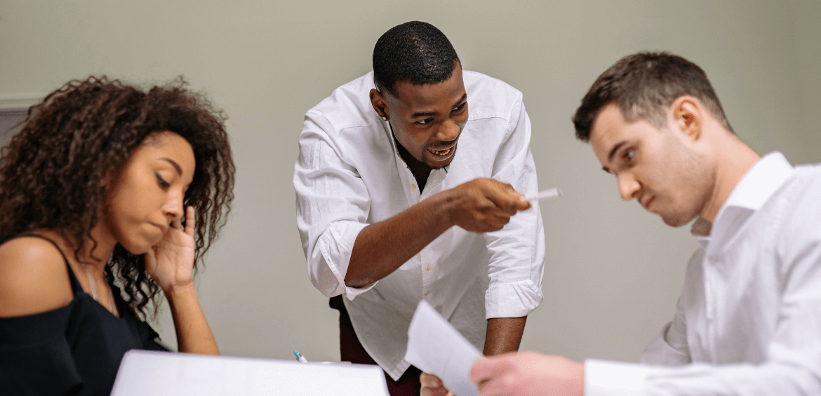 Man seeming to yell at a co-worker