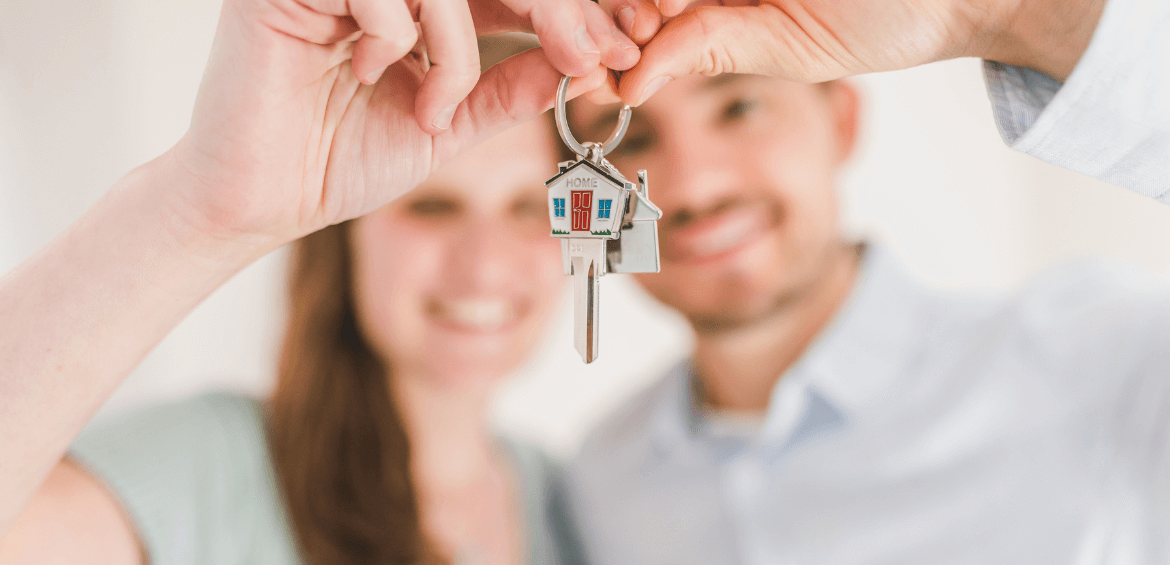 Couple with keys to a new home