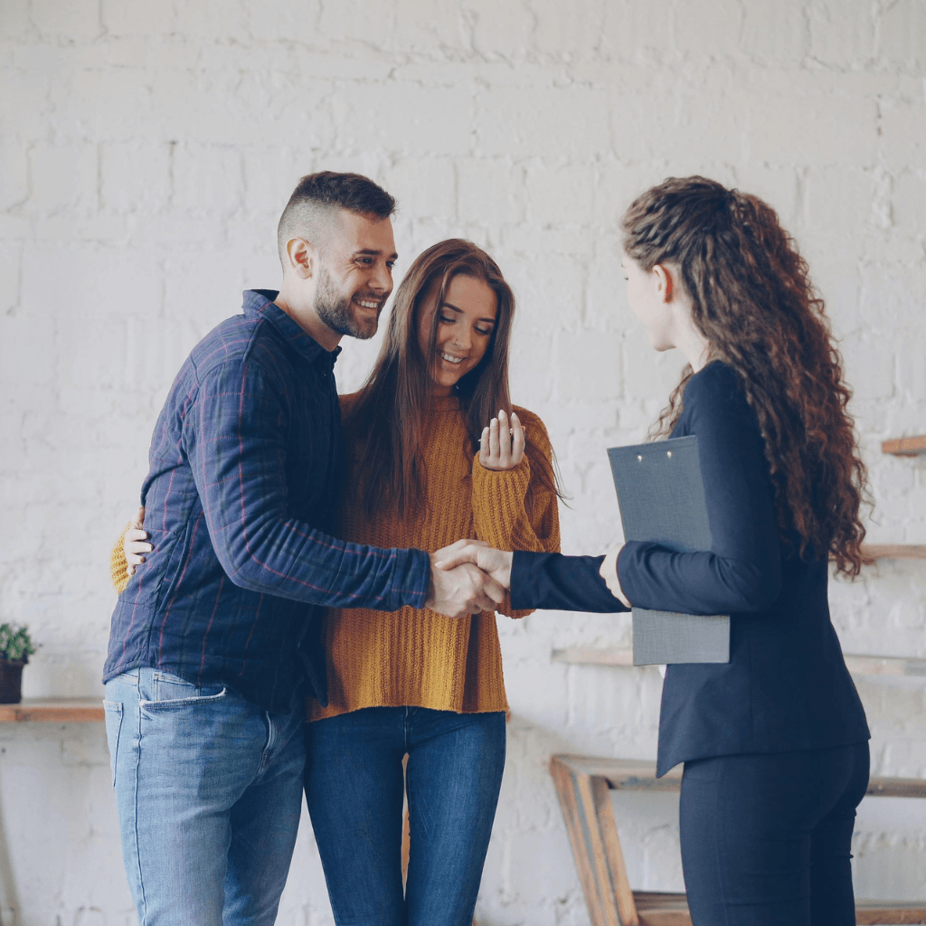 couple with a real estate agent